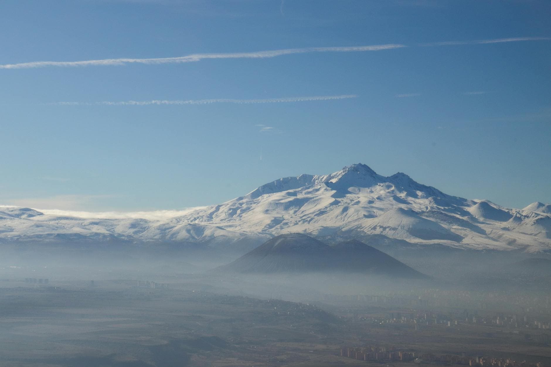 Aerial view of Mount Erciyes with snow and clouds in Kayseri, Turkey.