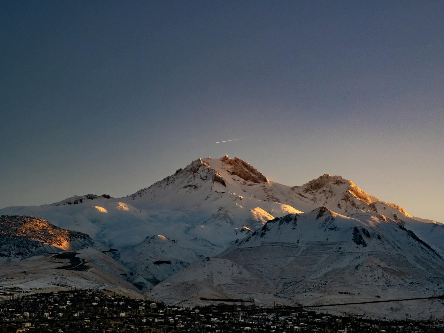 A breathtaking view of Mount Erciyes covered in snow during sunset in Kayseri, Turkey.
