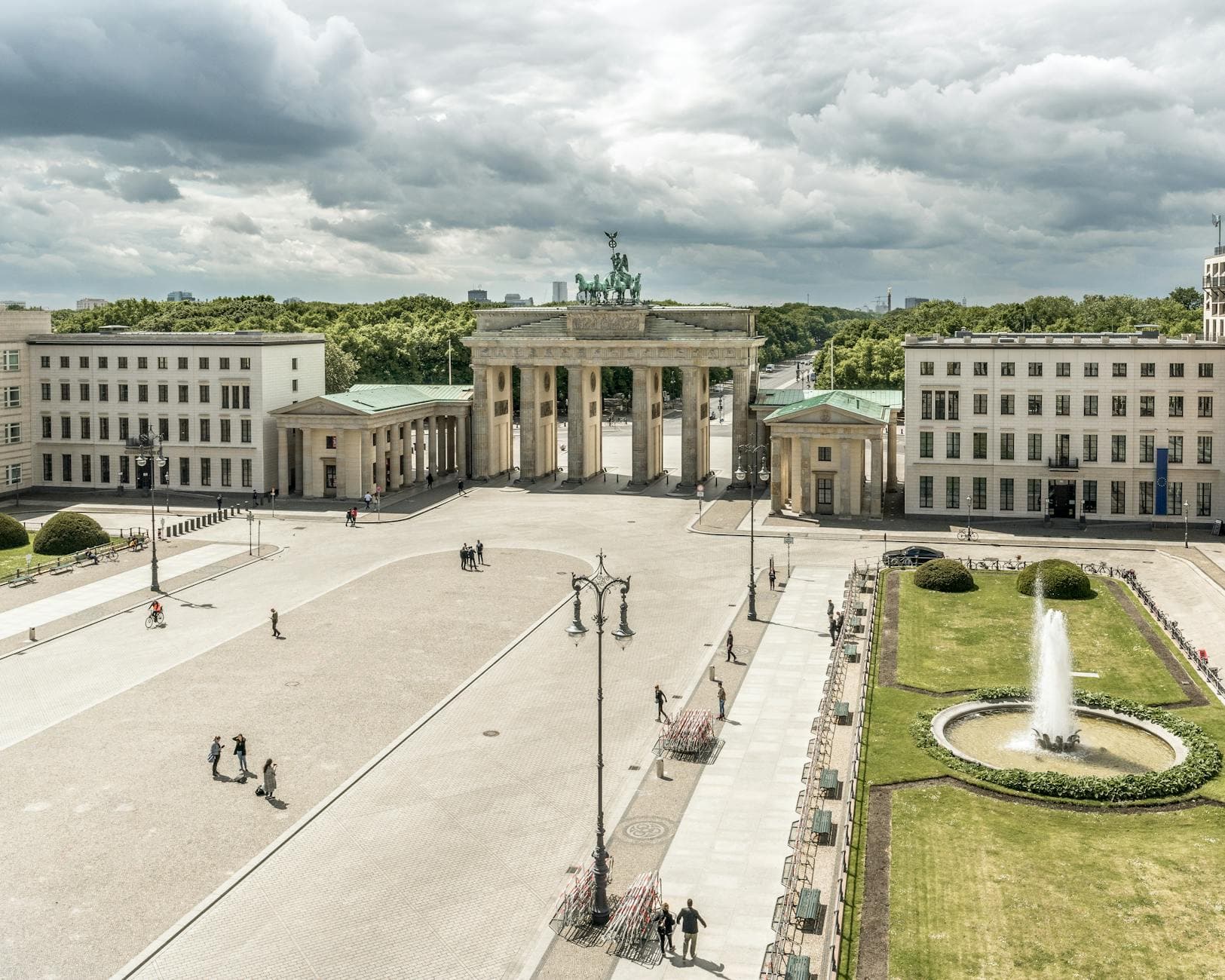 A stunning aerial shot of the iconic Brandenburg Gate in Berlin with few tourists.