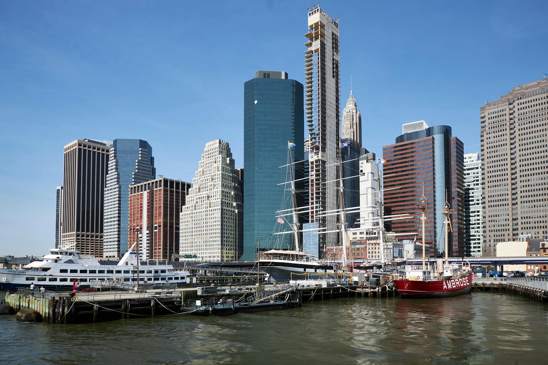 Scenic view of skyscrapers and Pier 17 along the waterfront in Downtown Manhattan, New York City.