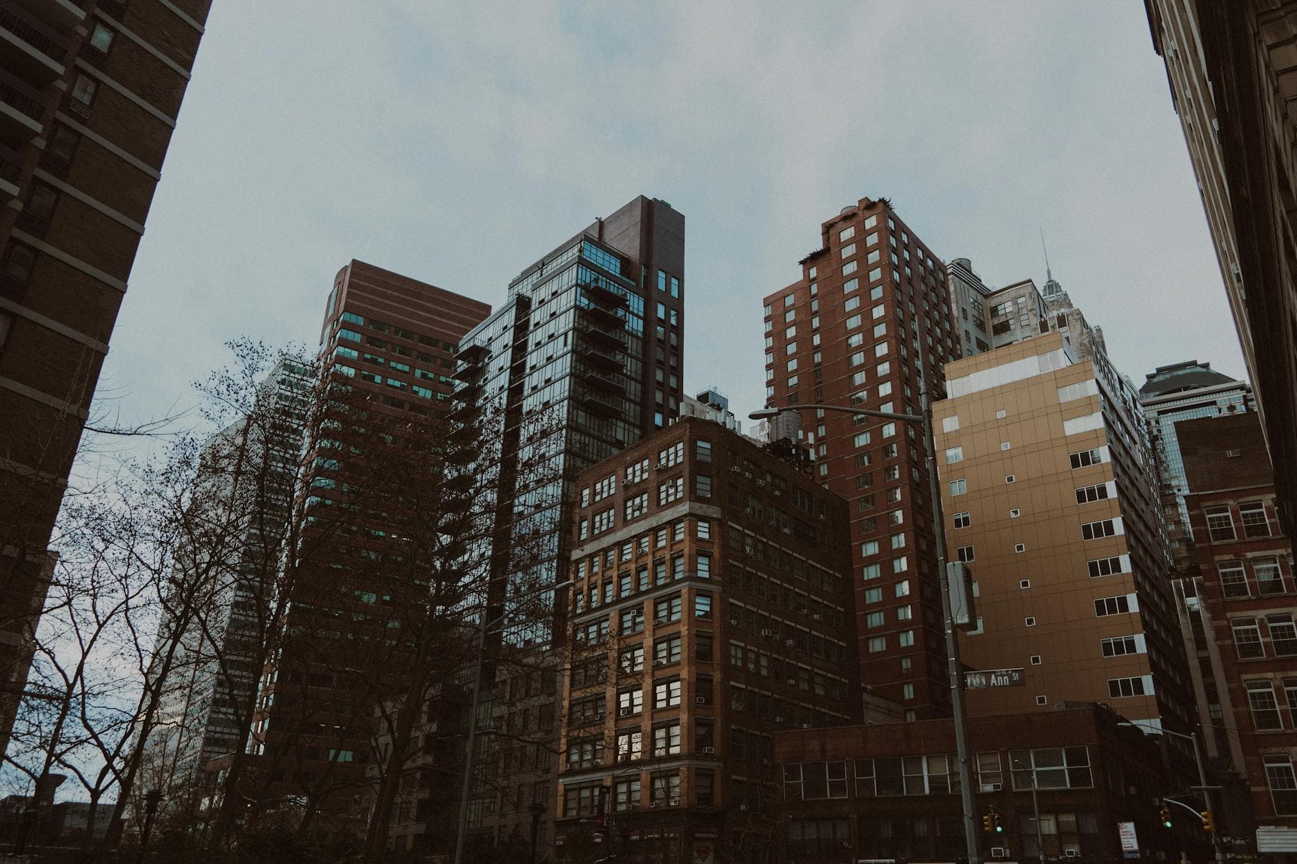View of modern skyscrapers in downtown New York City, showcasing diverse architectural styles.