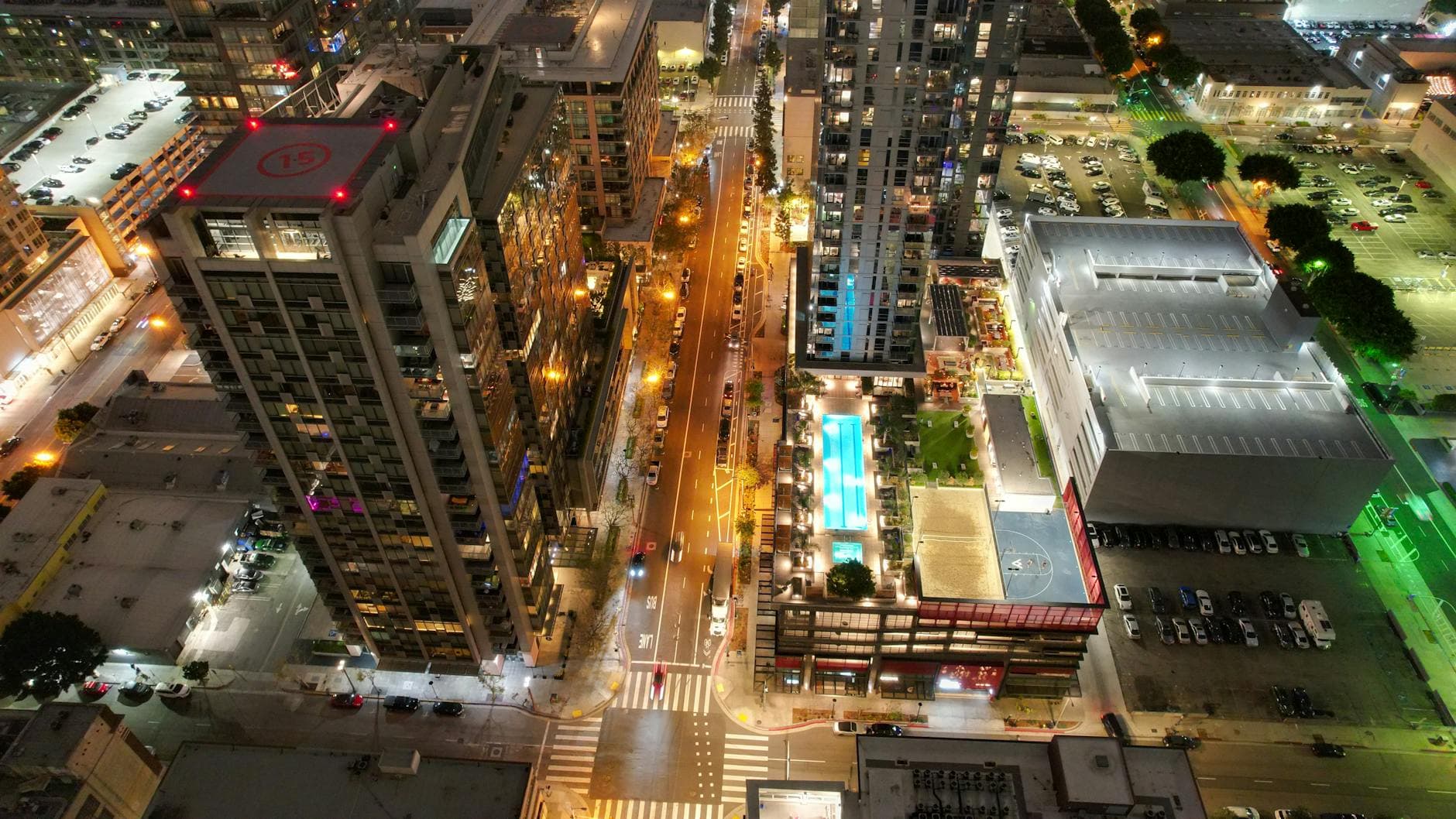 High-rise buildings and streets illuminated in downtown Los Angeles at night.