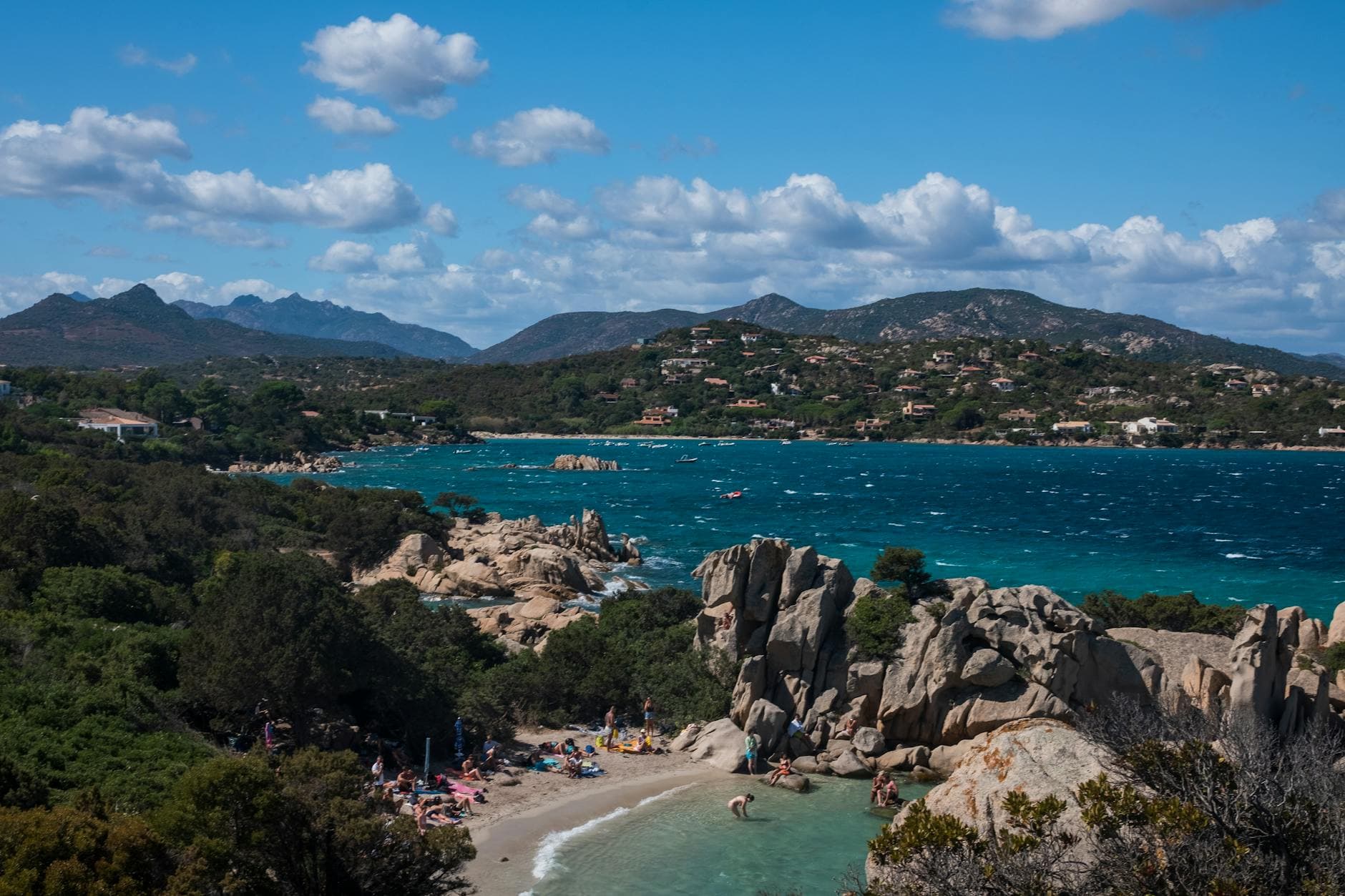 Explore the picturesque rocky coast and azure waters of Sardinia, Italy, perfect for summer travel.