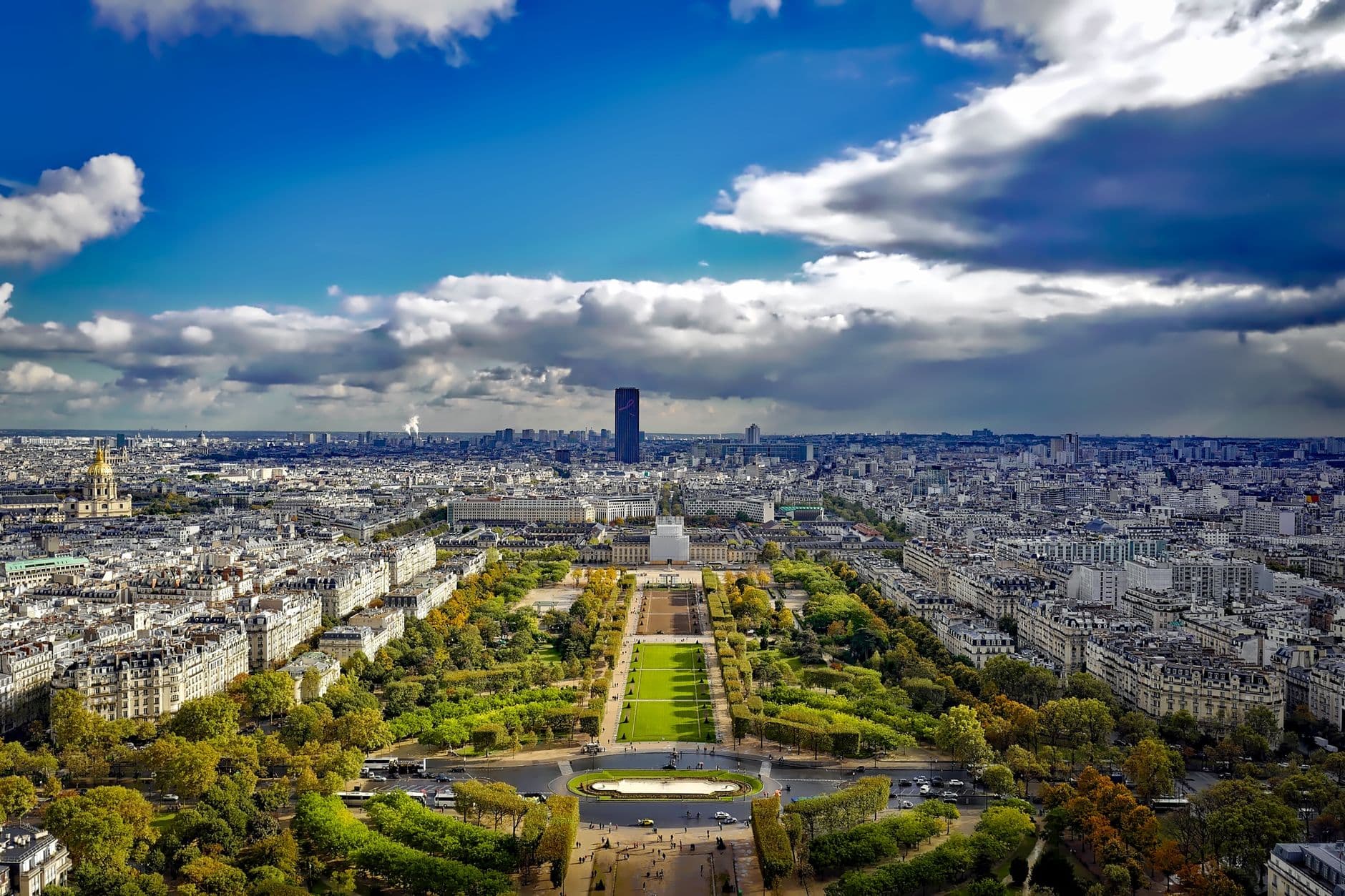 Stunning aerial view of Paris showcasing a picturesque skyline and lush central park.