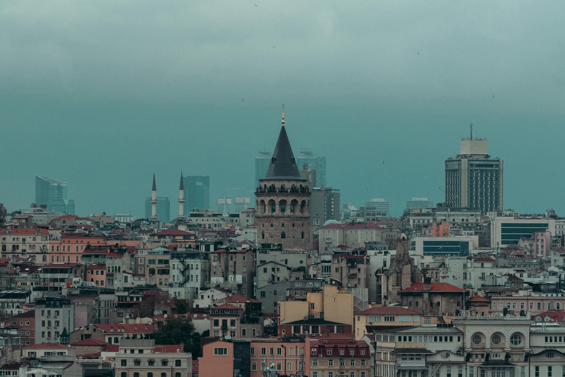 A captivating view of the historical Galata Tower surrounded by the bustling skyline of Istanbul.