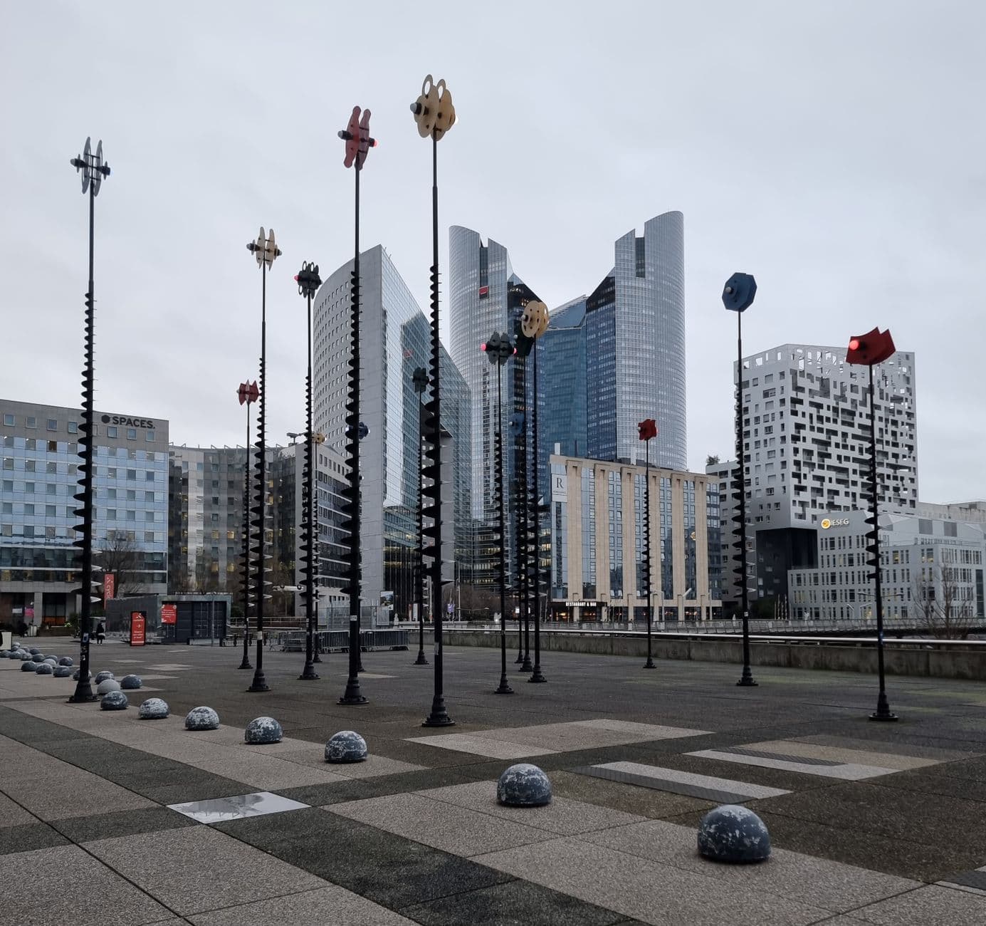 View of innovative skyscrapers and public art in La Défense, Paris.