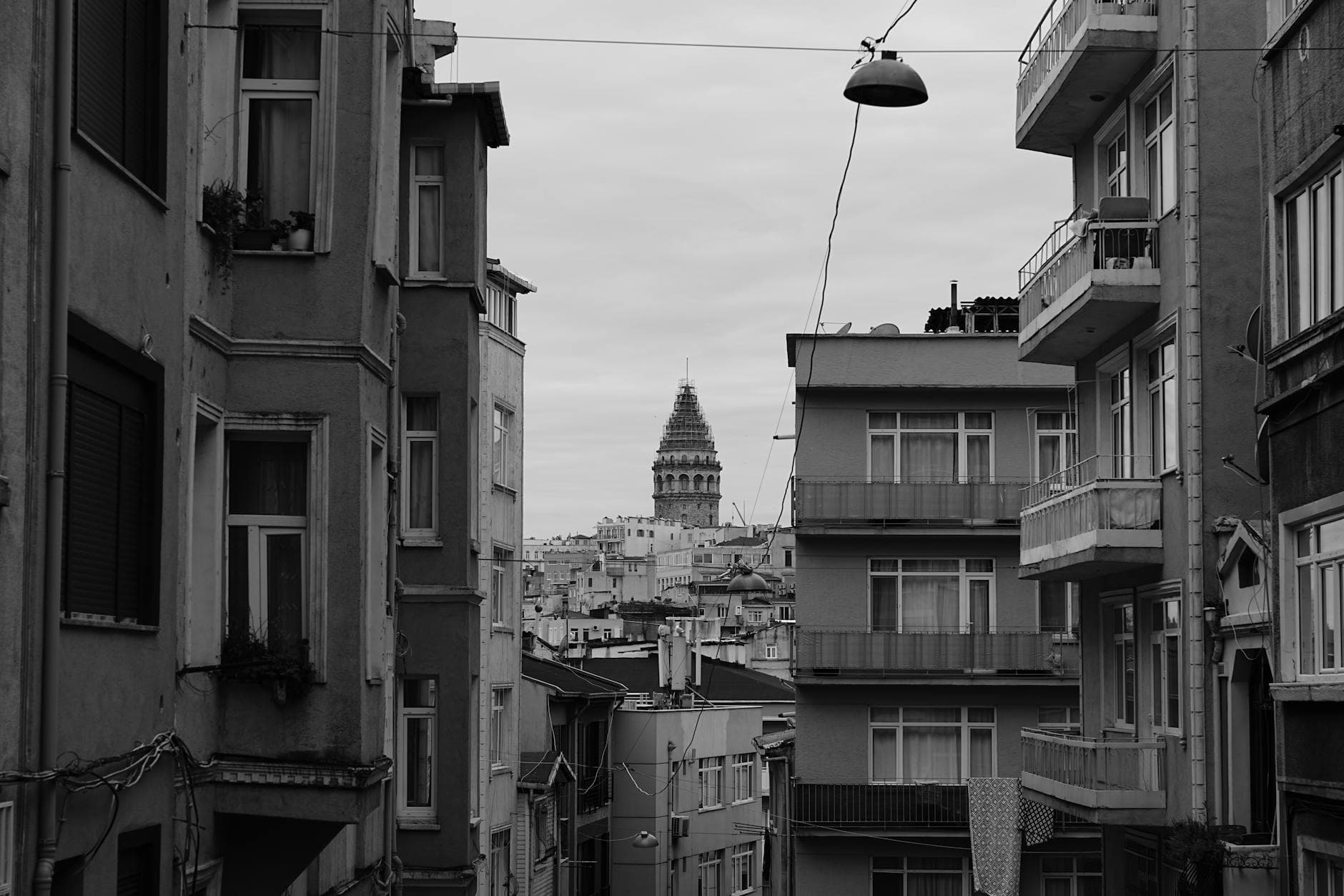 Monochrome view of Istanbul's urban landscape featuring the iconic Galata Tower.