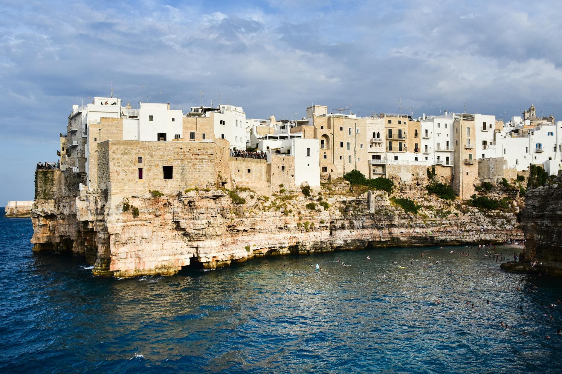Experience the beauty of Polignano a Mare's historic architecture perched on rugged cliffs above the Adriatic Sea.