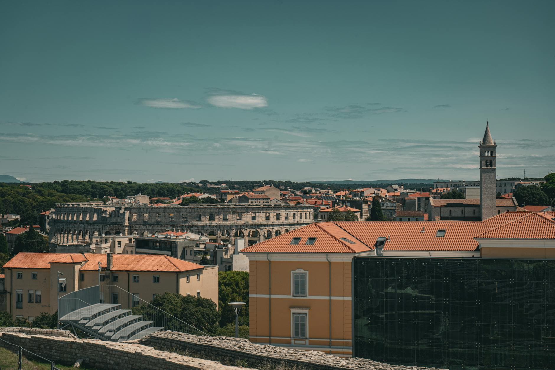 A picturesque aerial view of Pula, Croatia, featuring the historic Roman amphitheater.
