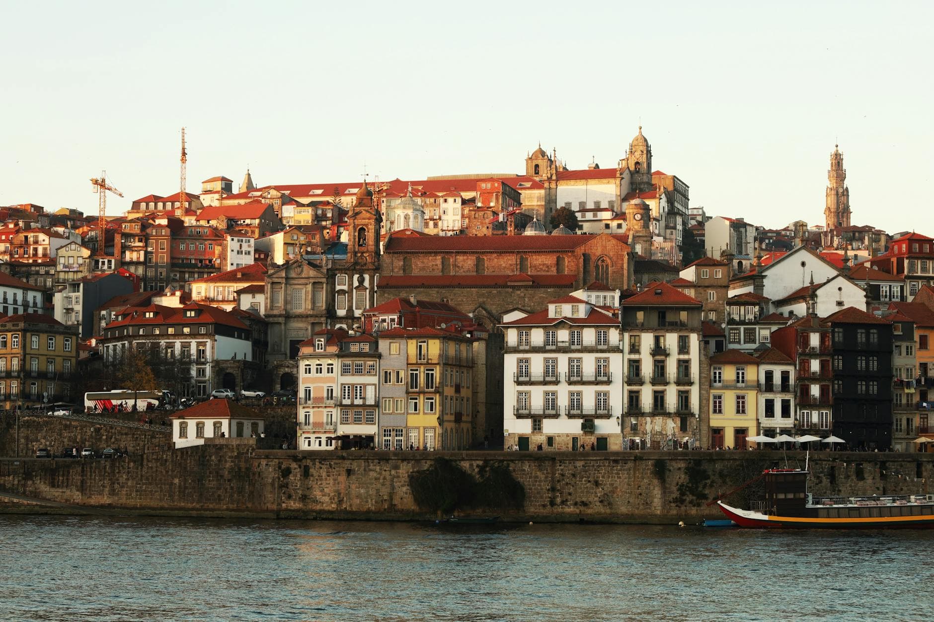 A vibrant cityscape of Porto, Portugal’s historic riverside with colorful houses.