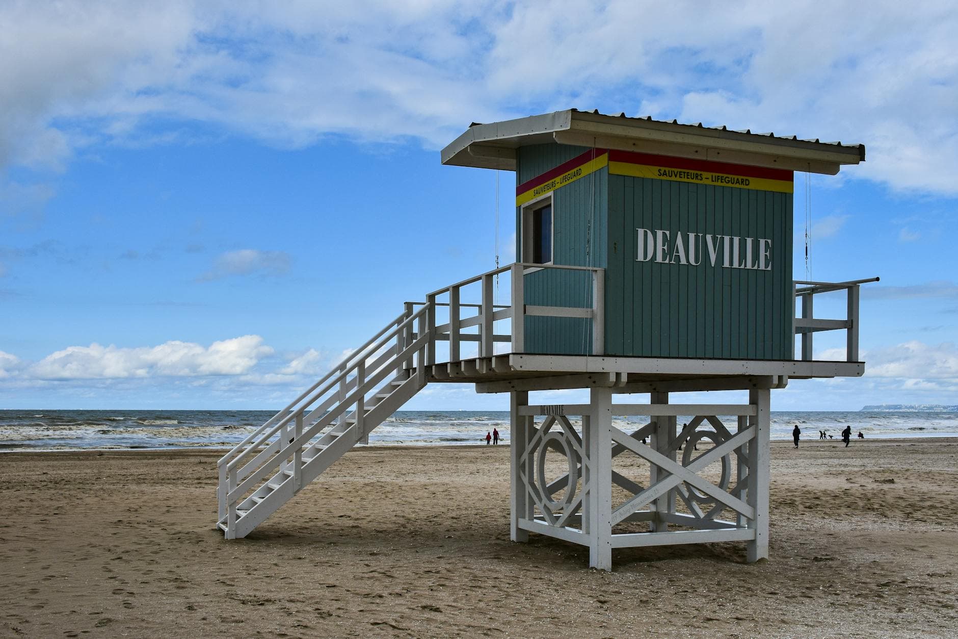 Lifeguard station on sandy Deauville beach in Normandy, France, with ocean view.