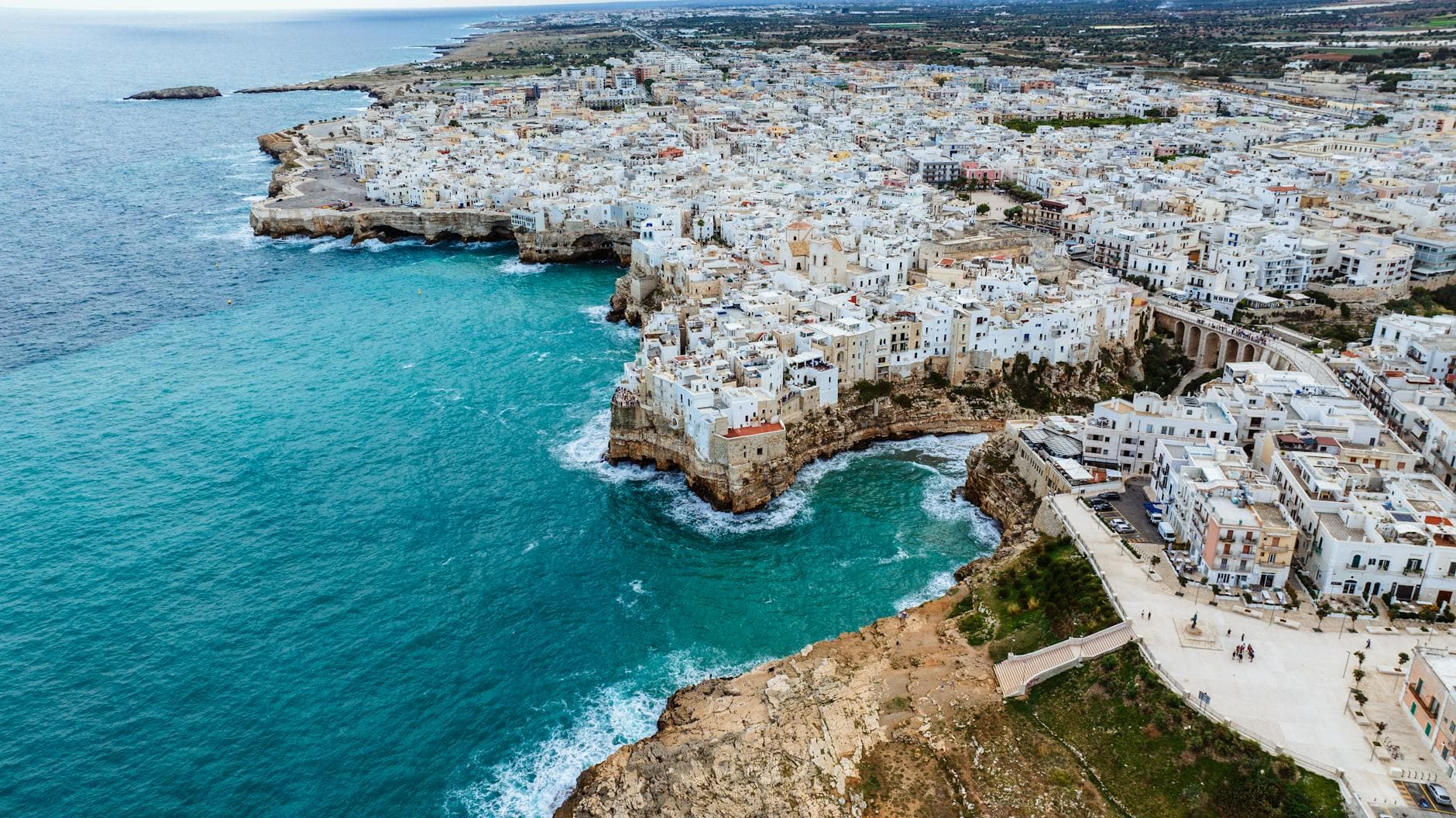Stunning aerial view of Polignano a Mare, Italy, showcasing its coastal beauty and historic architecture.