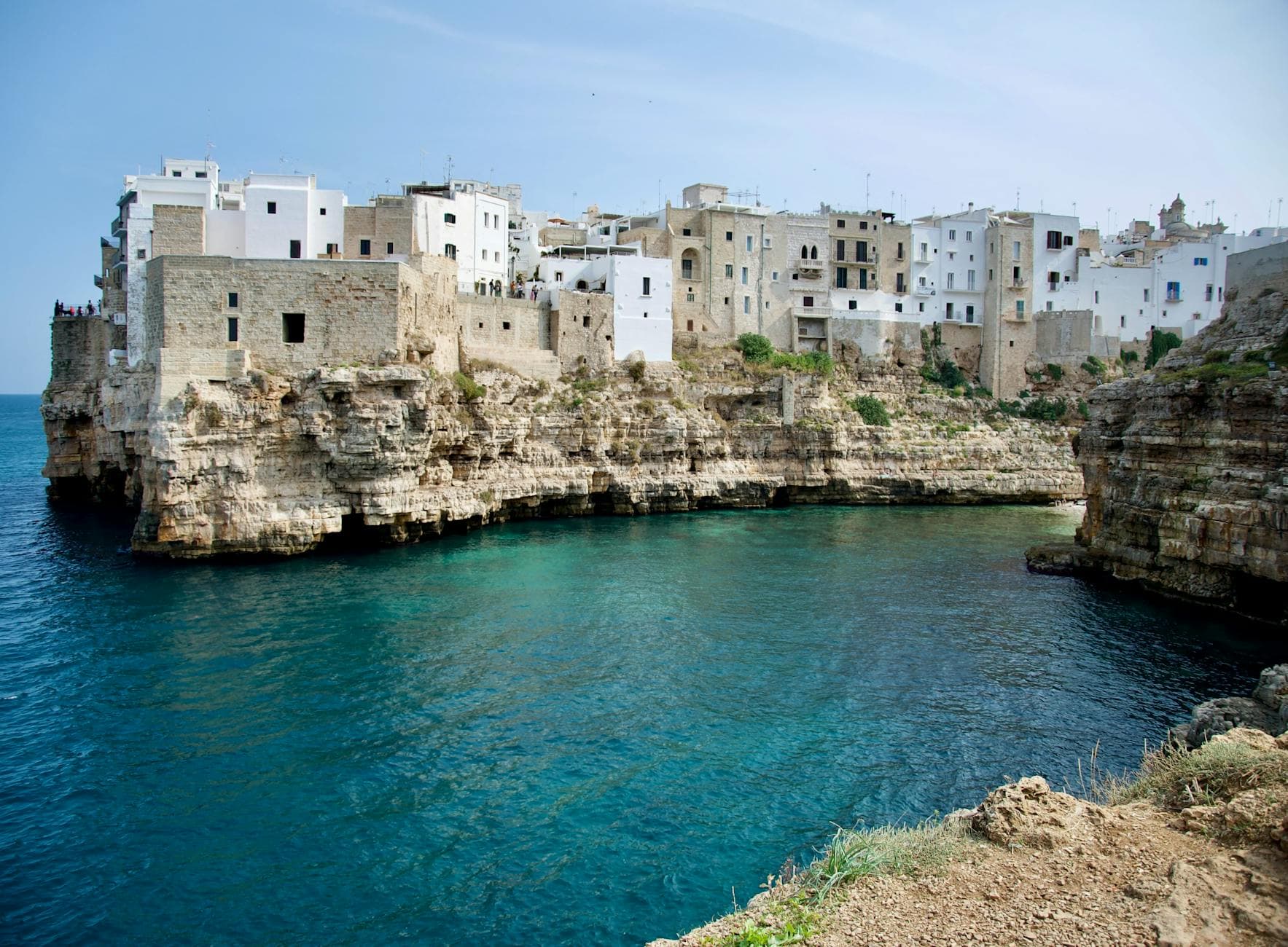 Discover the stunning seaside view of Polignano a Mare with its cliffside architecture and turquoise waters.