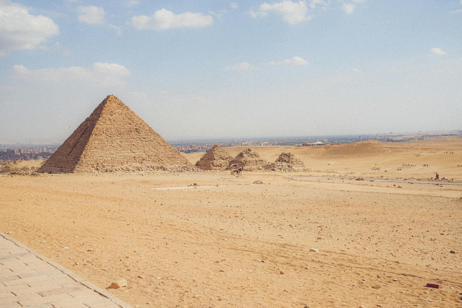 A stunning view of the Pyramids of Giza on a sunny day, highlighting the ancient Egyptian architecture.