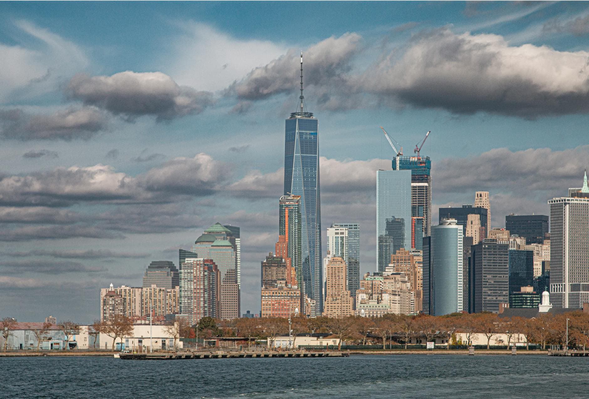 Captivating view of the New York City skyline featuring One World Trade Center on a sunny day.
