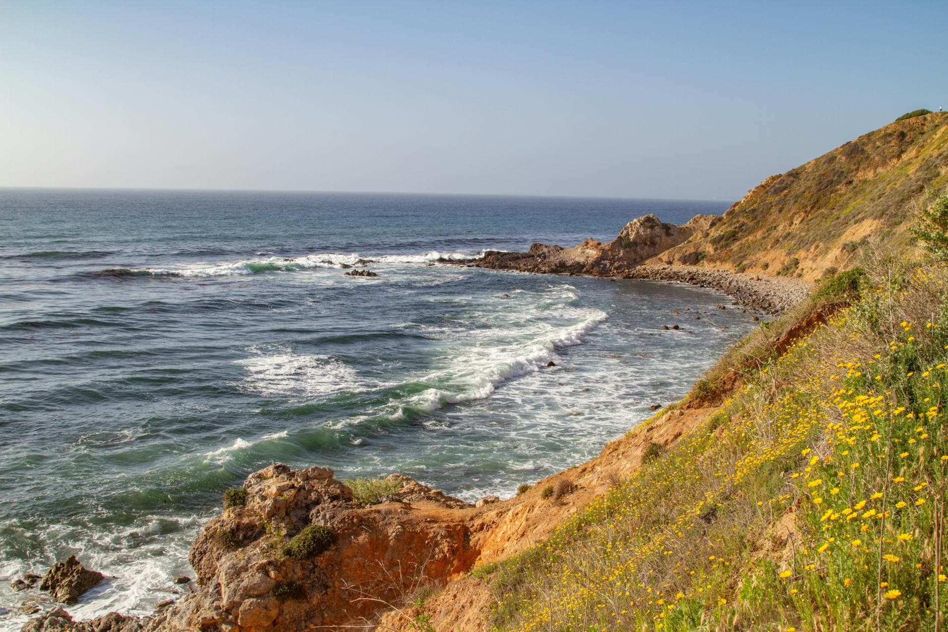 Breathtaking view of the coast at Rancho Palos Verdes, California with waves crashing against rocky shores.