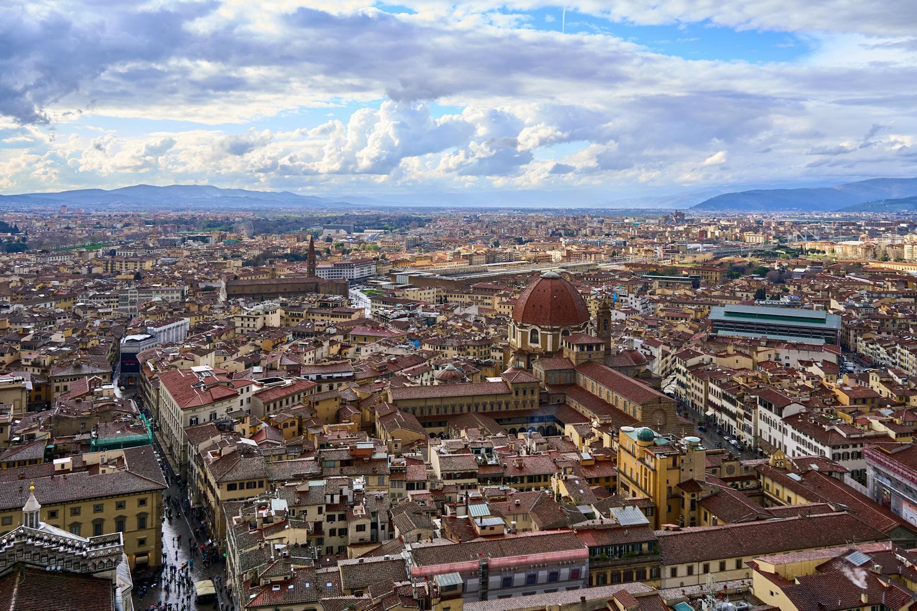 Discover the breathtaking aerial view of Florence with the iconic red dome and sprawling city center.