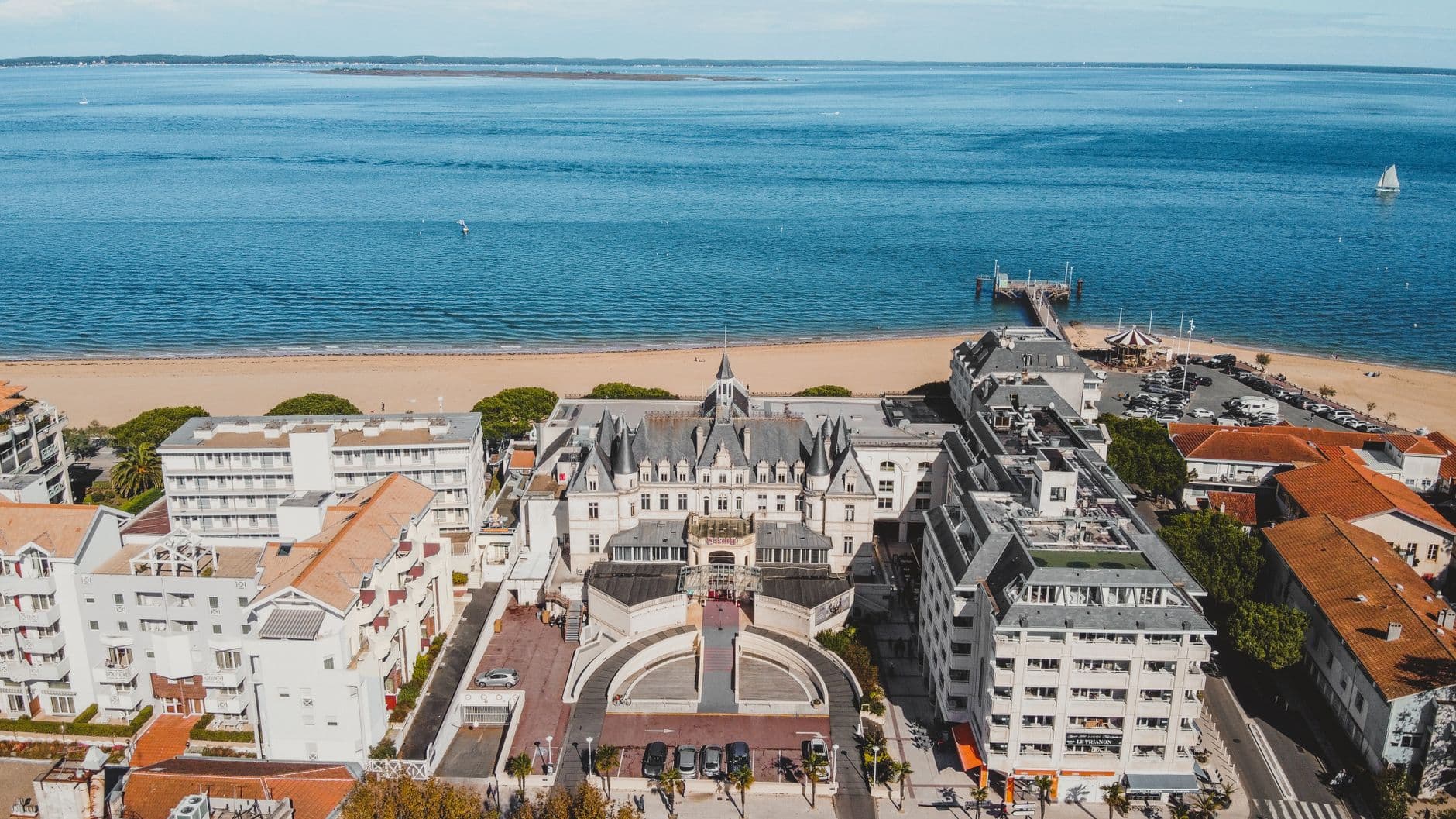 Aerial view capturing the stunning sea and coastline of Arcachon, featuring Casino de la Plage.