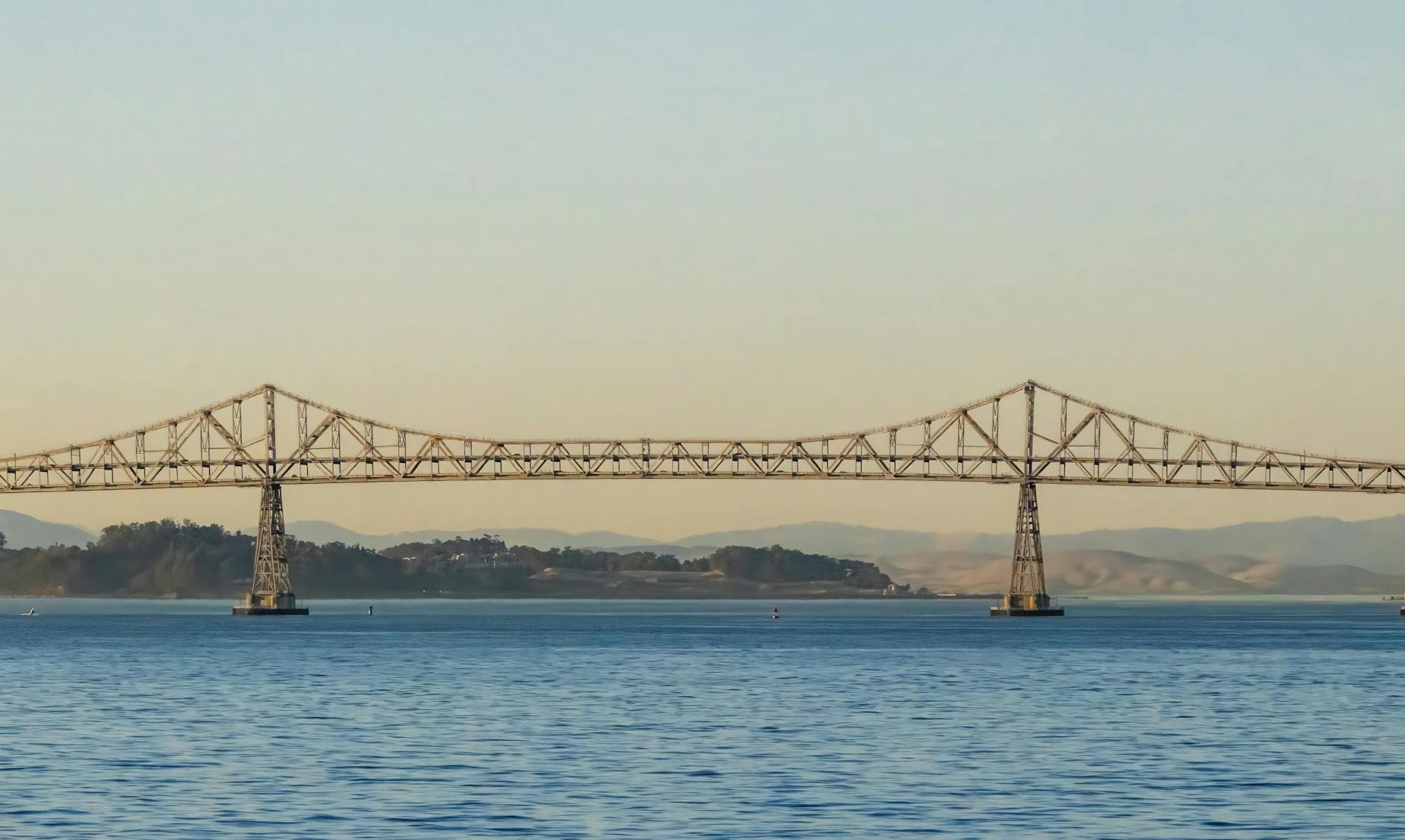 Scenic view of the Richmond-San Rafael Bridge across San Francisco Bay at twilight.