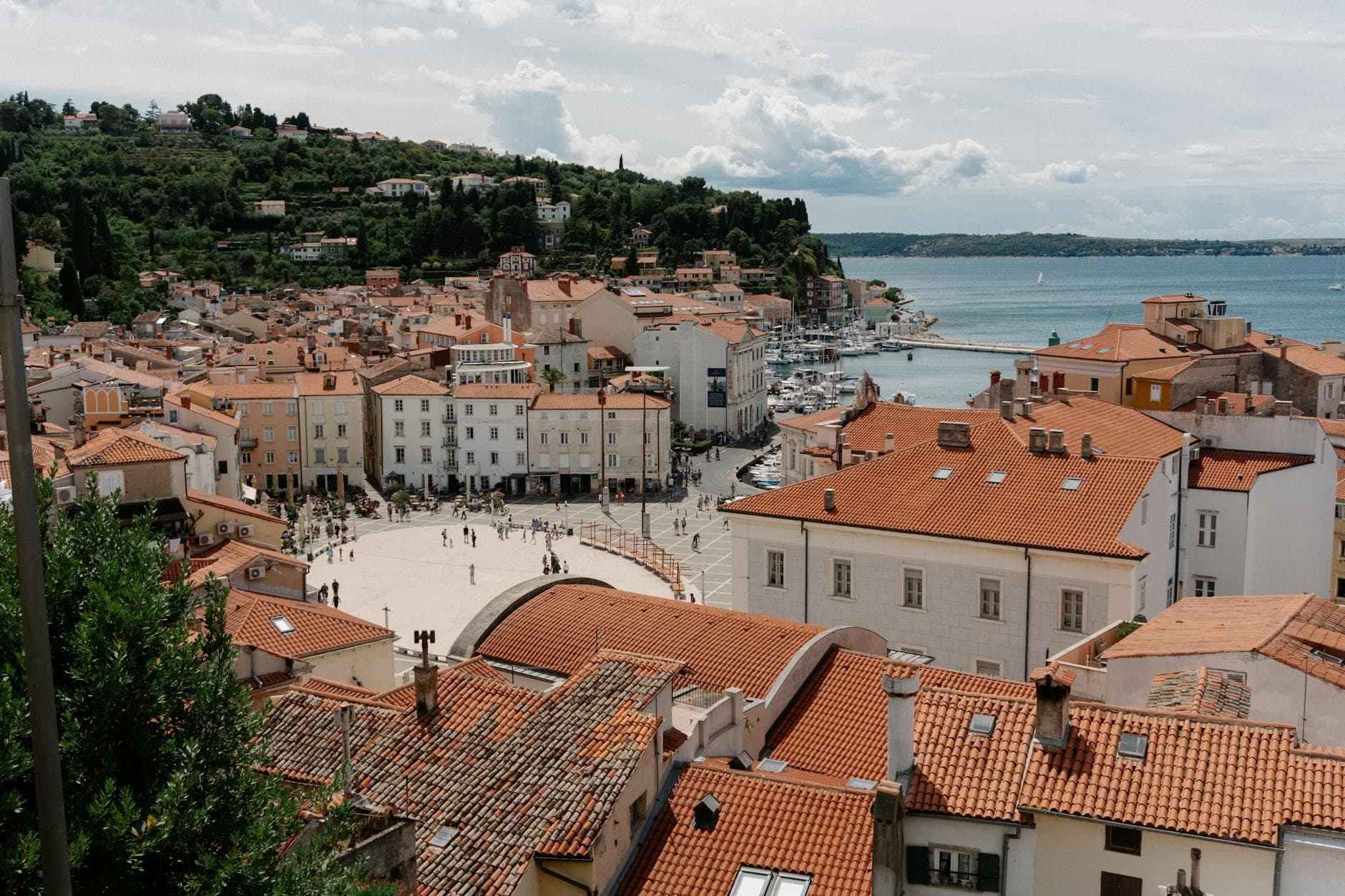 Scenic aerial view of Piran, Slovenia featuring historic architecture and the Adriatic Sea.