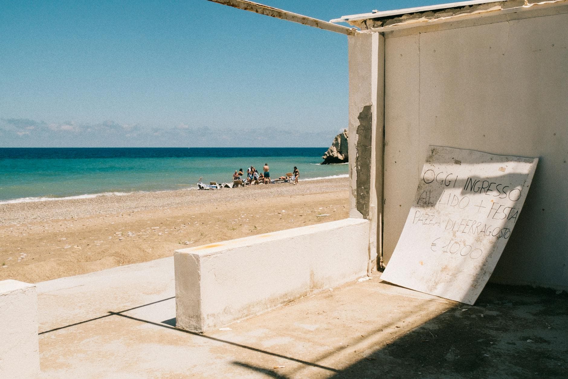 Relaxing summer beach view in Altavilla Milicia, Sicily with people enjoying the seaside.