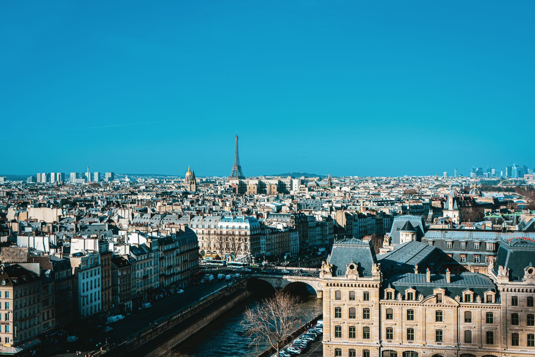 Stunning aerial view of Paris skyline showcasing the iconic Eiffel Tower and historic architecture.