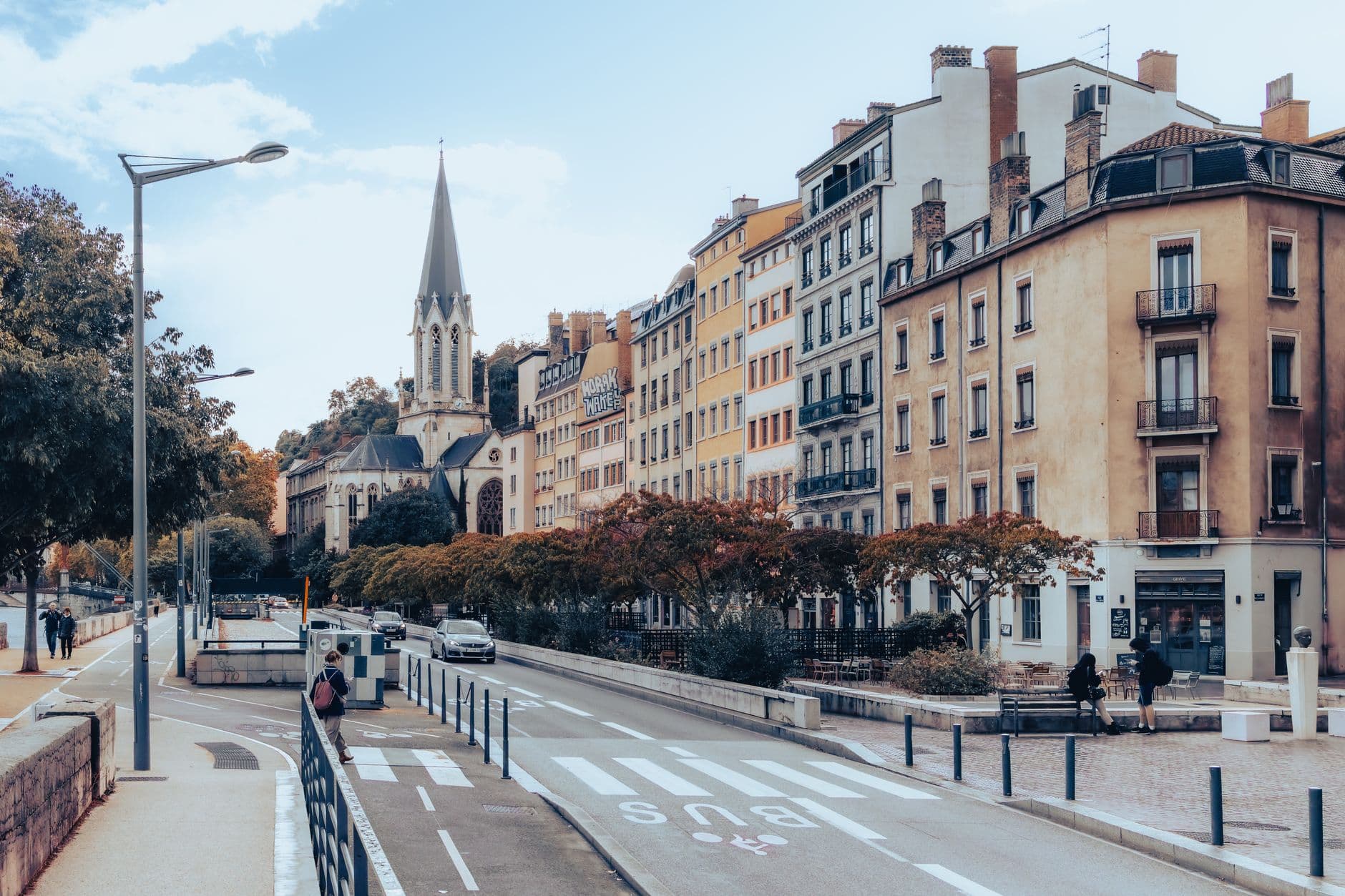 Captivating street scene in Lyon, France, showcasing historical architecture and vibrant urban life.