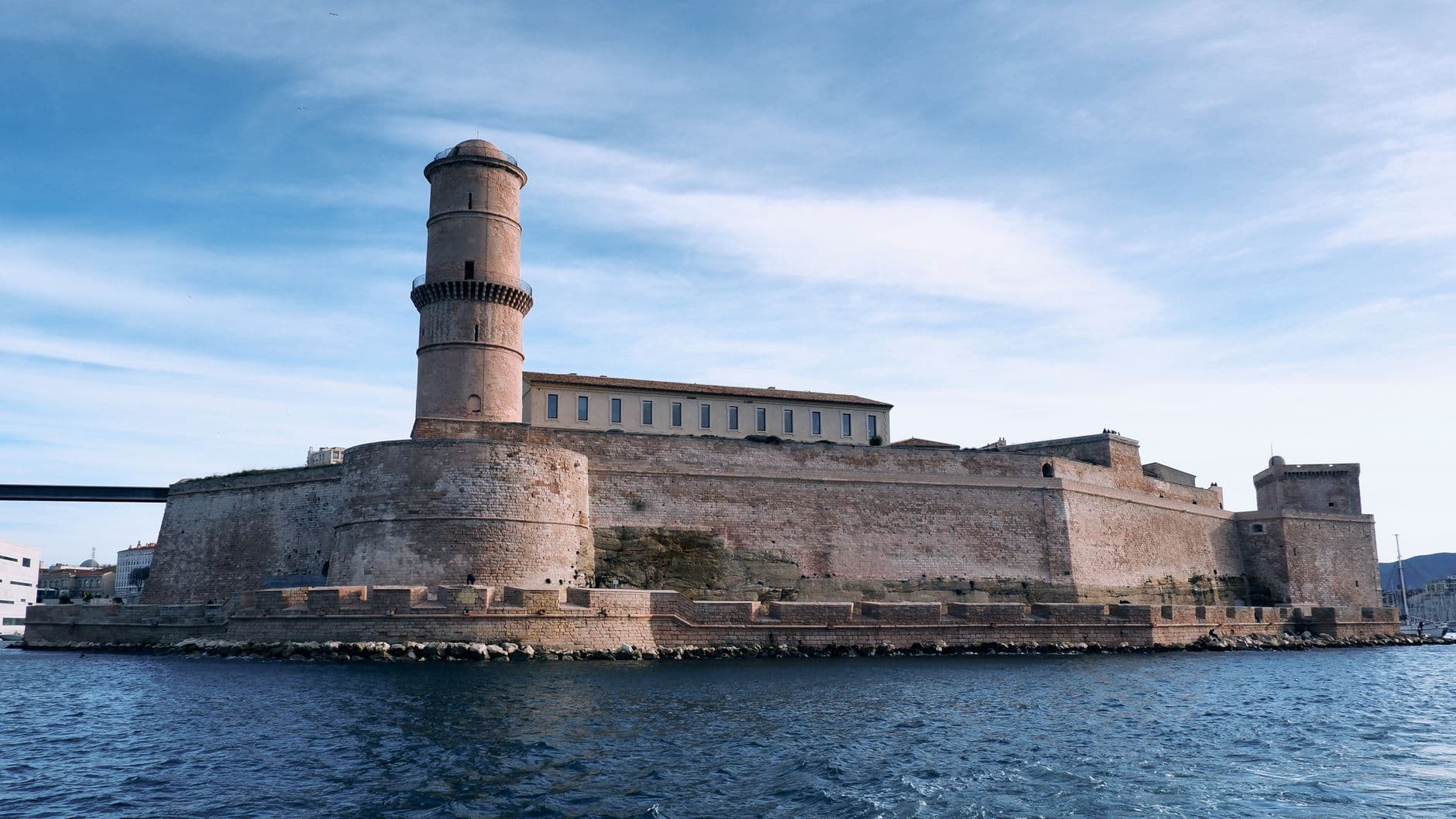 Captured view of a historic fortress in Marseille, showcasing its classic architecture by the Mediterranean Sea.