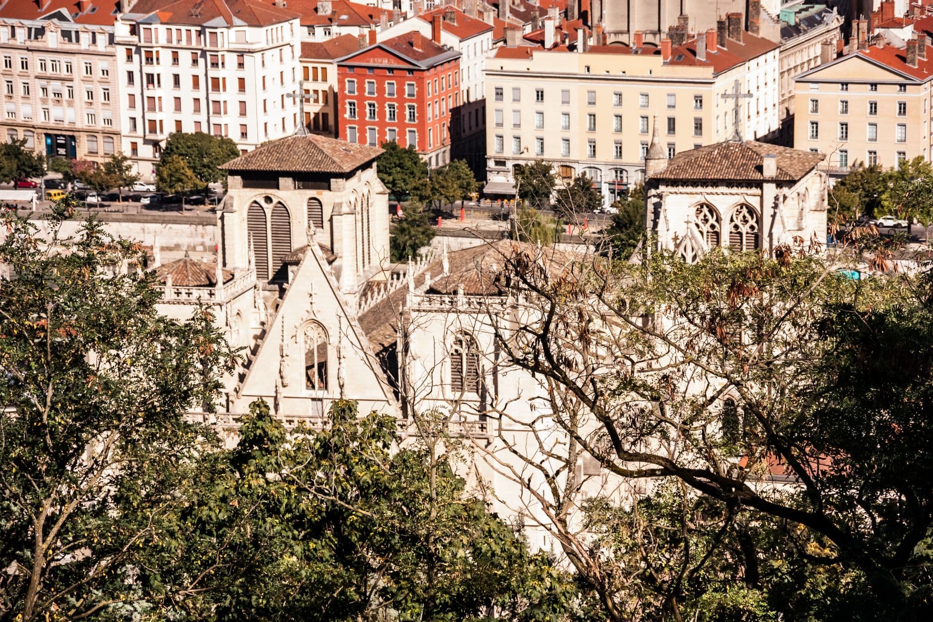 A panoramic view of the historical Saint-Jean Cathedral and urban architecture in Lyon, France.