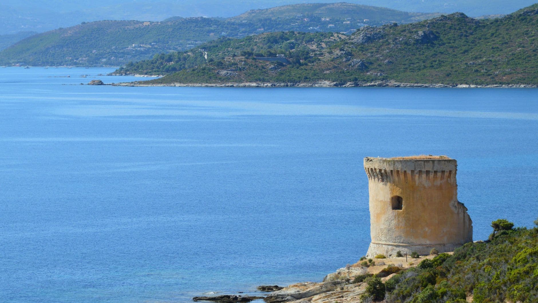 Picturesque view of a Genoese tower on the coast of Saint-Florent, Corsica.