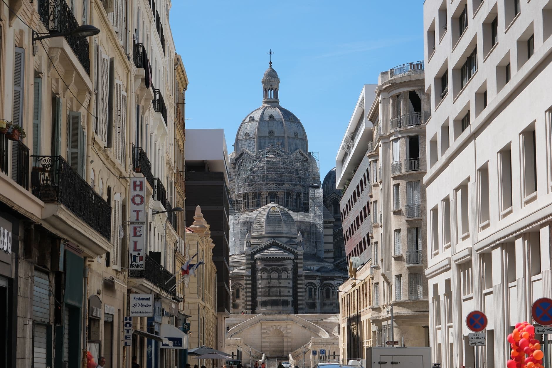 Street view of Neo-Byzantine Cathedral undergoing renovation in Marseille, France.