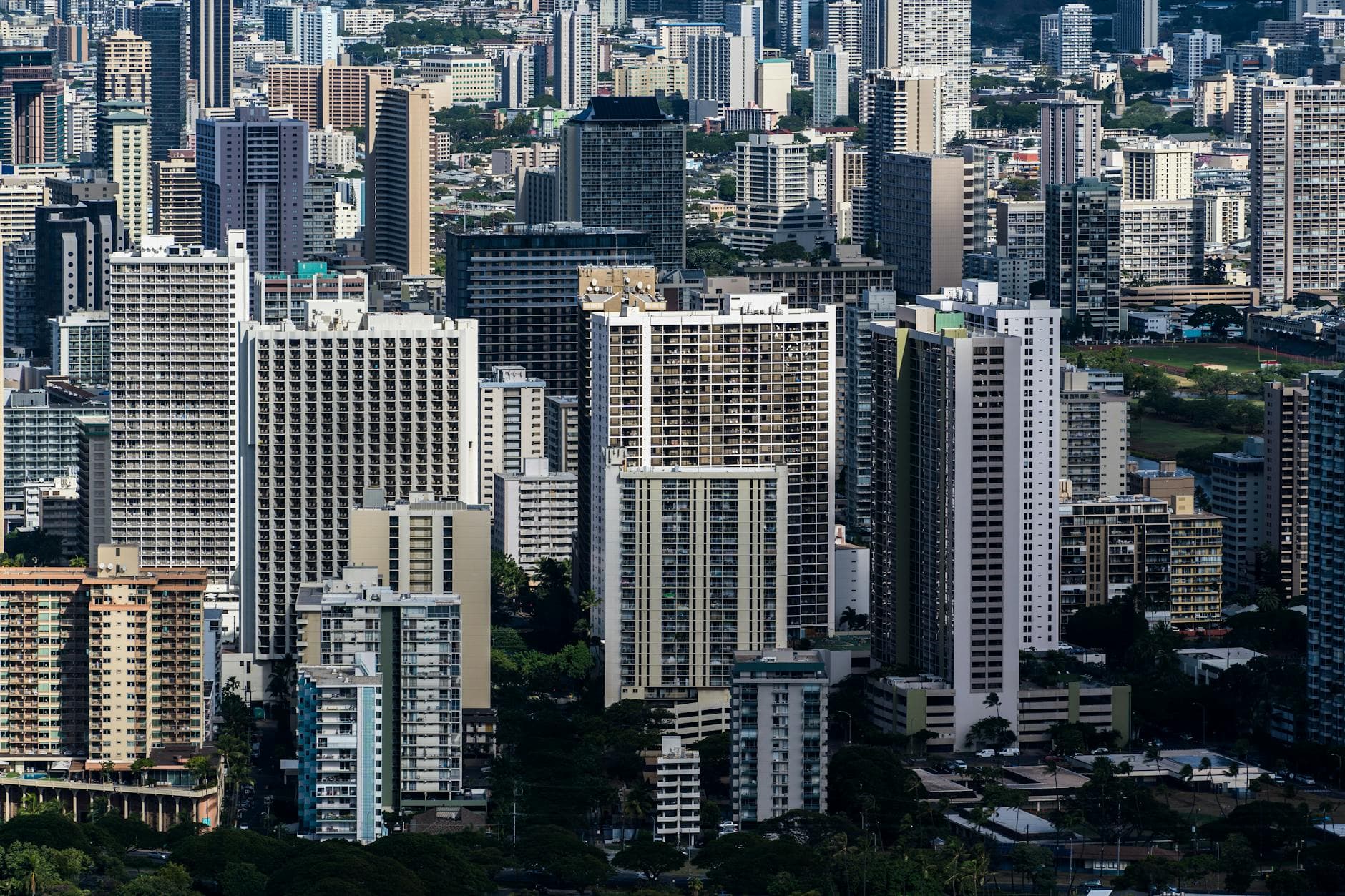 Explore the dynamic cityscape of Honolulu with towering skyscrapers and urban architecture.