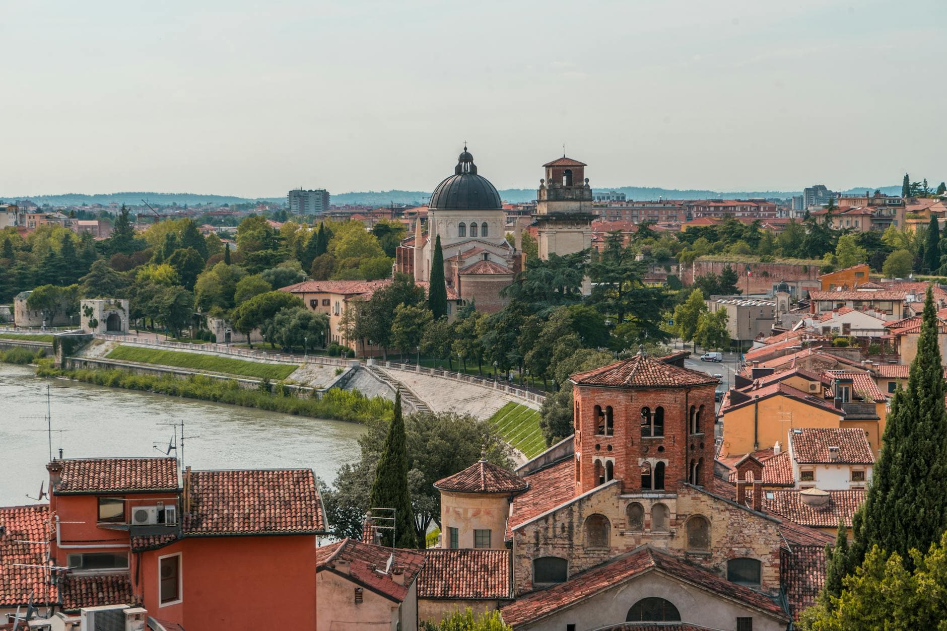 Explore Verona's stunning cityscape with historic architecture along the Adige River.