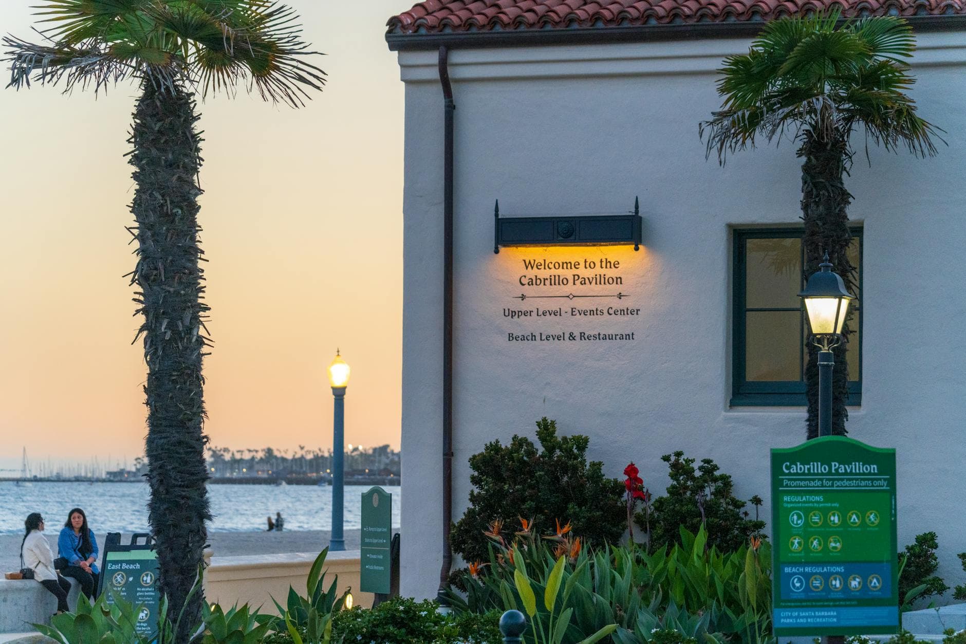 A scenic view of Cabrillo Pavilion and beach during a vibrant Santa Barbara sunset.