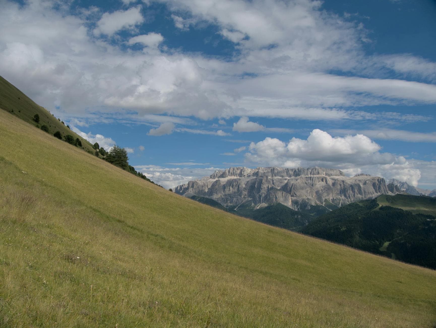 Beautiful landscape view of the Dolomites with lush green meadows in Santa Cristina Valgardena, Italy.