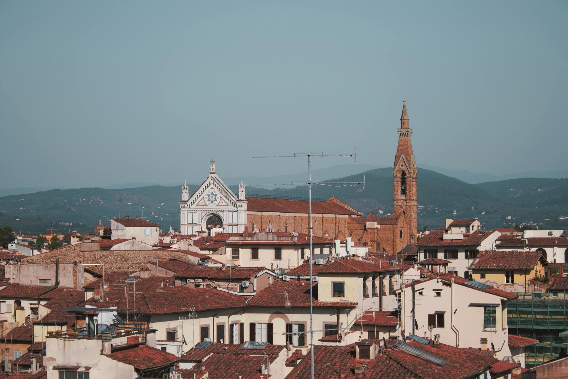 Explore the stunning aerial cityscape of Florence featuring the iconic Santa Croce Basilica.