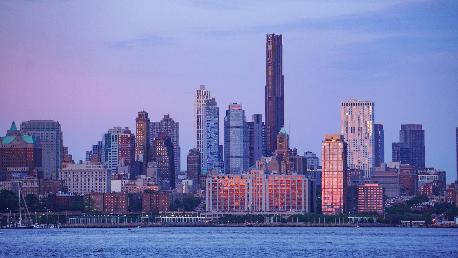 Stunning view of New York City skyline with skyscrapers at twilight.