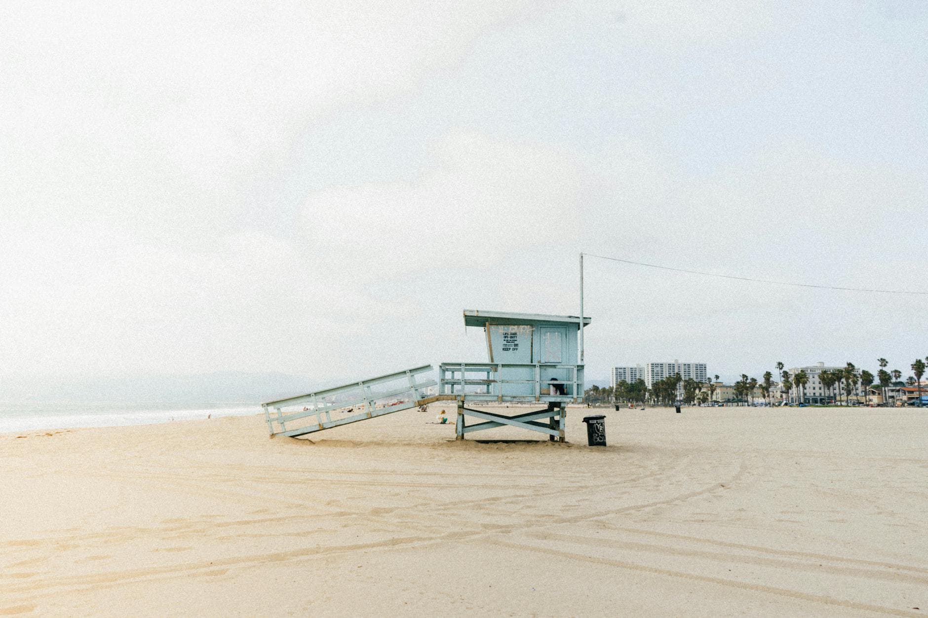 Scenic view of a lifeguard tower on the sandy beach of Santa Monica, Los Angeles.