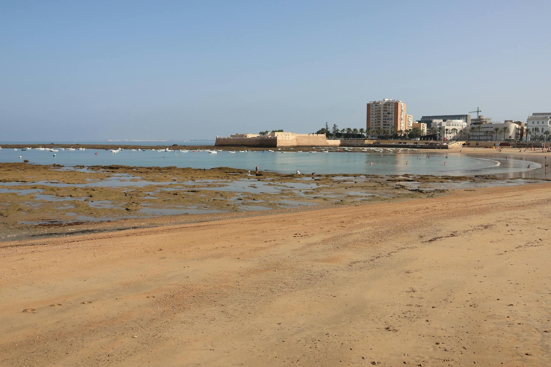 Beautiful beach overlook with historic fortress in Cádiz, Spain.