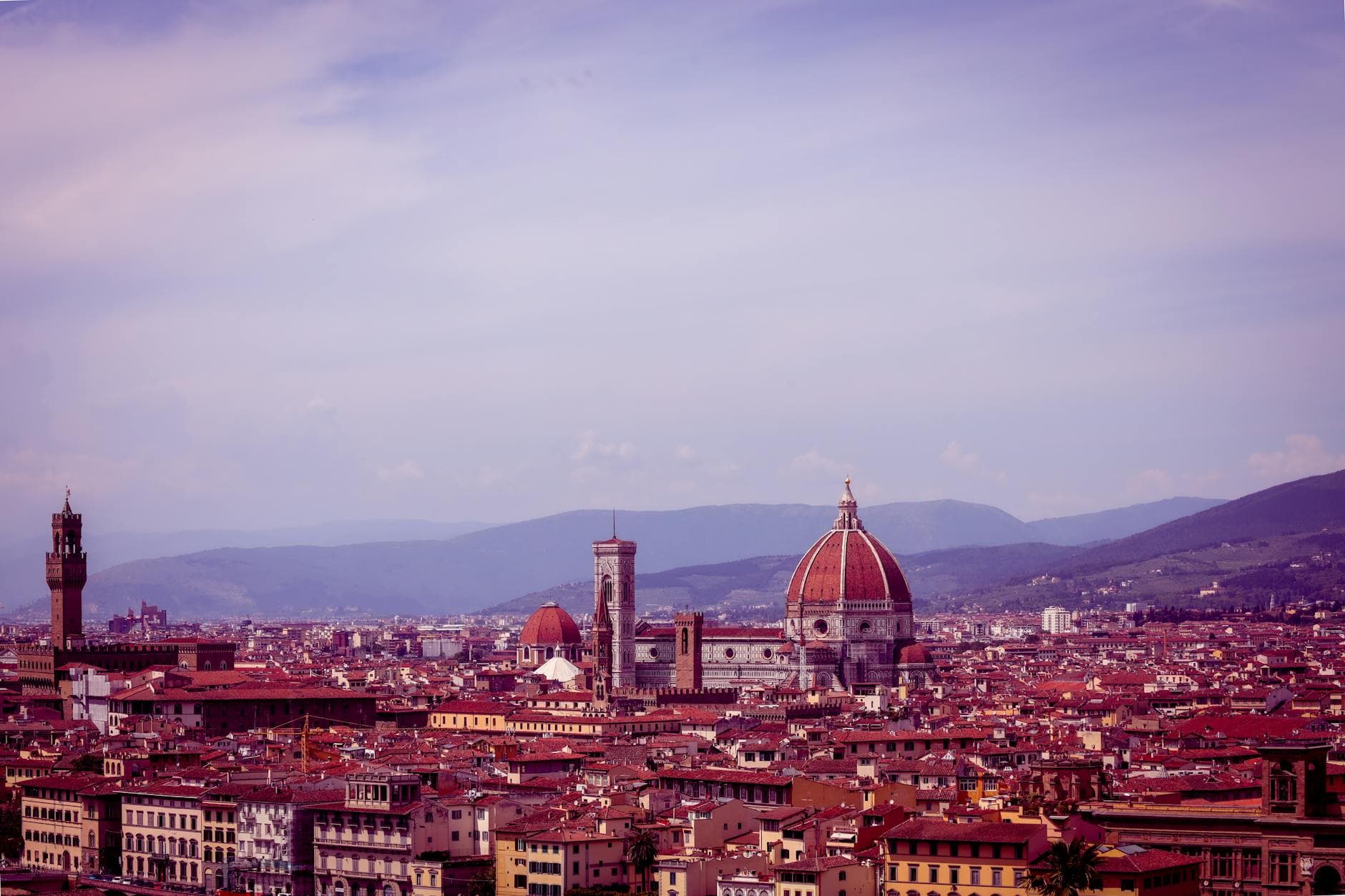 Stunning aerial view of Florence showcasing the iconic Duomo and surrounding cityscape.