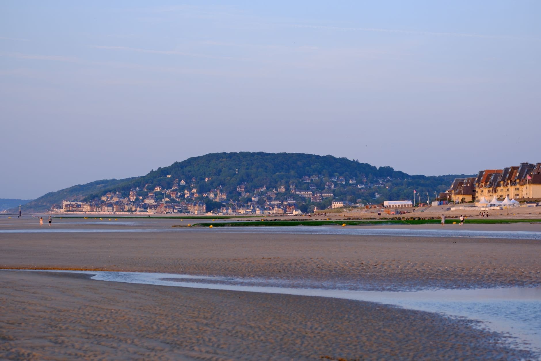 Wide view of Cabourg beach and surrounding landscape in Normandie, France at day time.