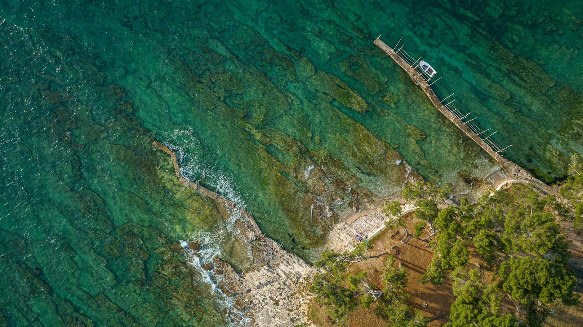 Aerial view of Savudrija's pristine coastline with crystal-clear waters and lush greenery.