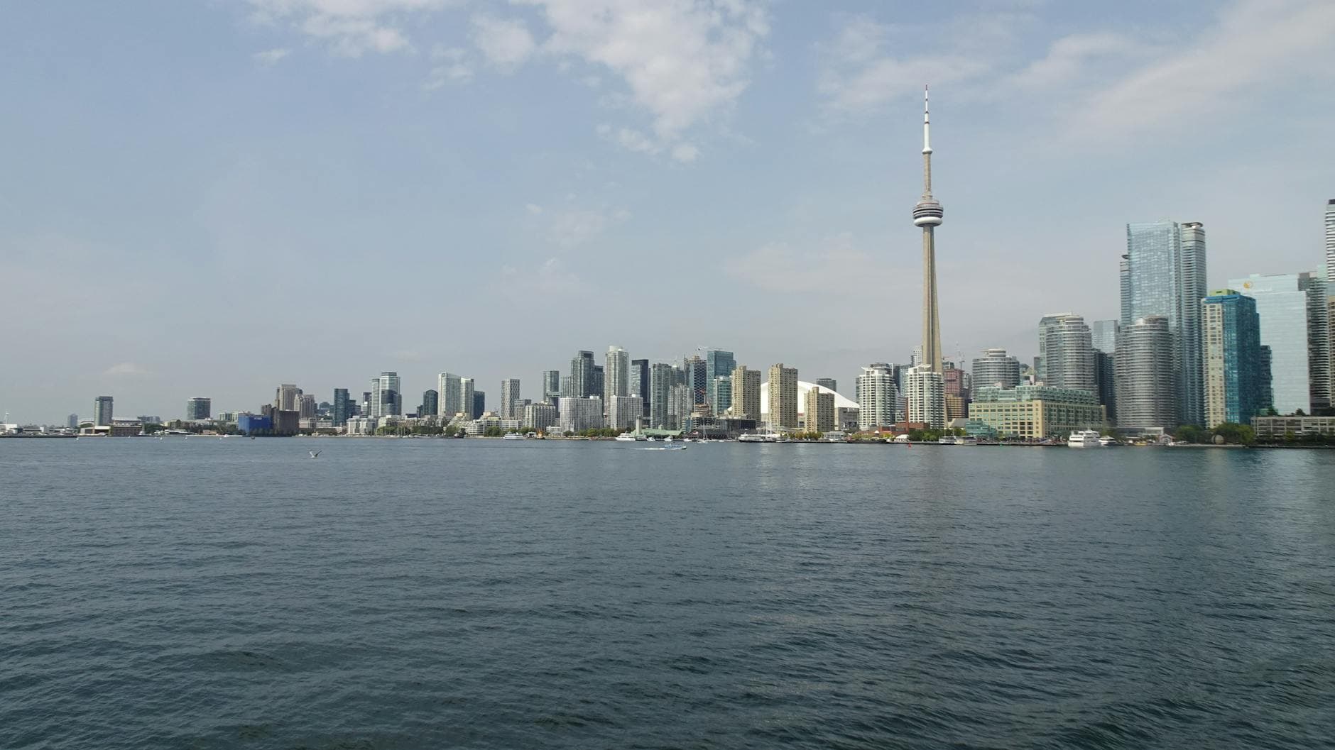 Beautiful view of Toronto skyline including the iconic CN Tower from the waterfront.