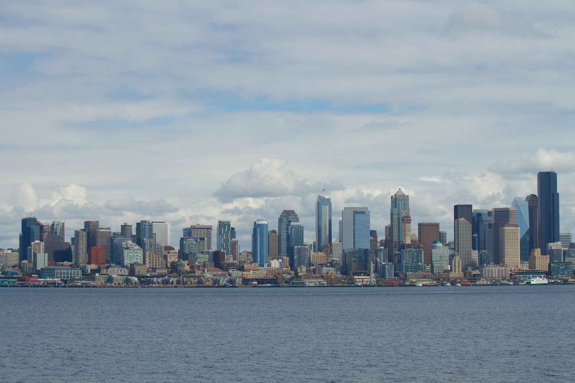 Scenic view of Seattle's iconic skyline with prominent skyscrapers and waterfront.