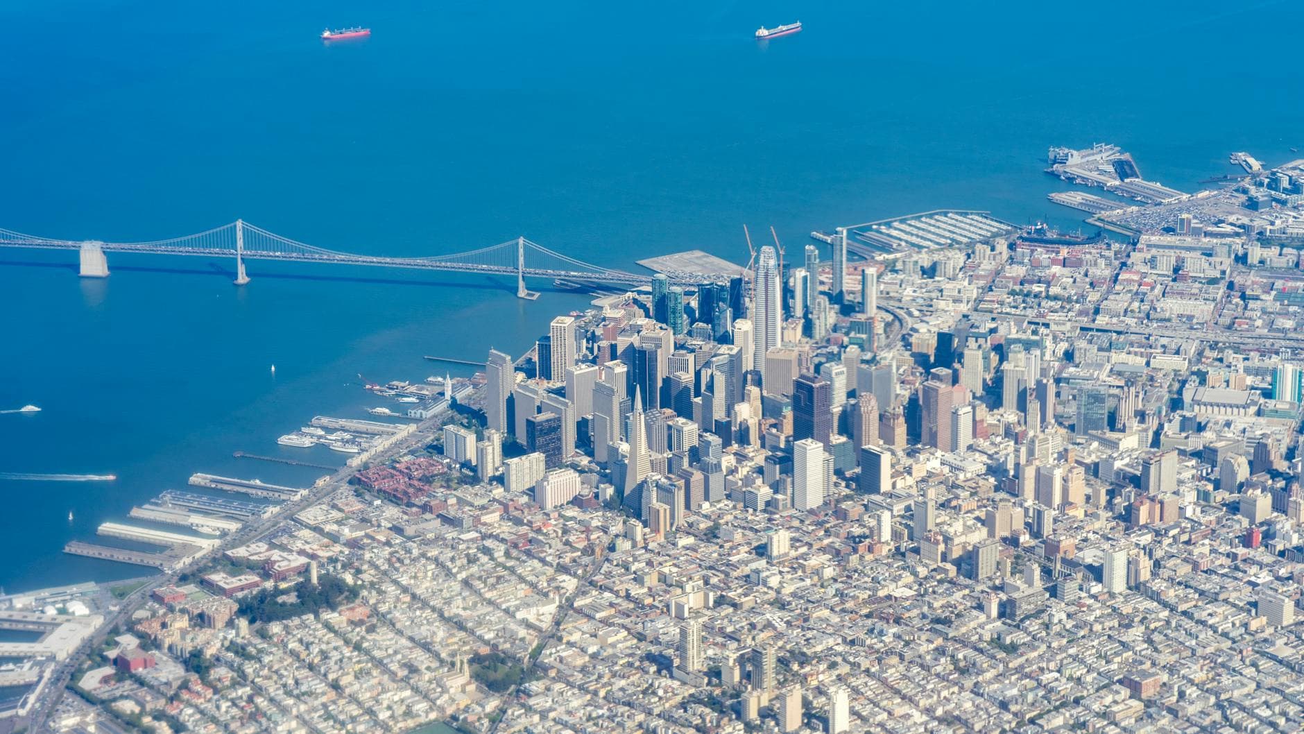 Stunning aerial view of San Francisco skyline featuring iconic skyscrapers and the bay bridge.