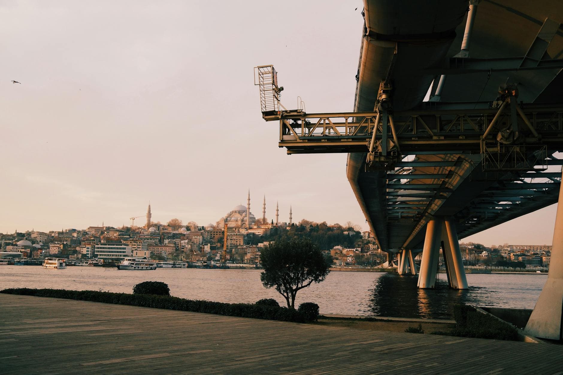 Cityscape of Istanbul featuring a modern bridge and historic skyline, captured during the day.