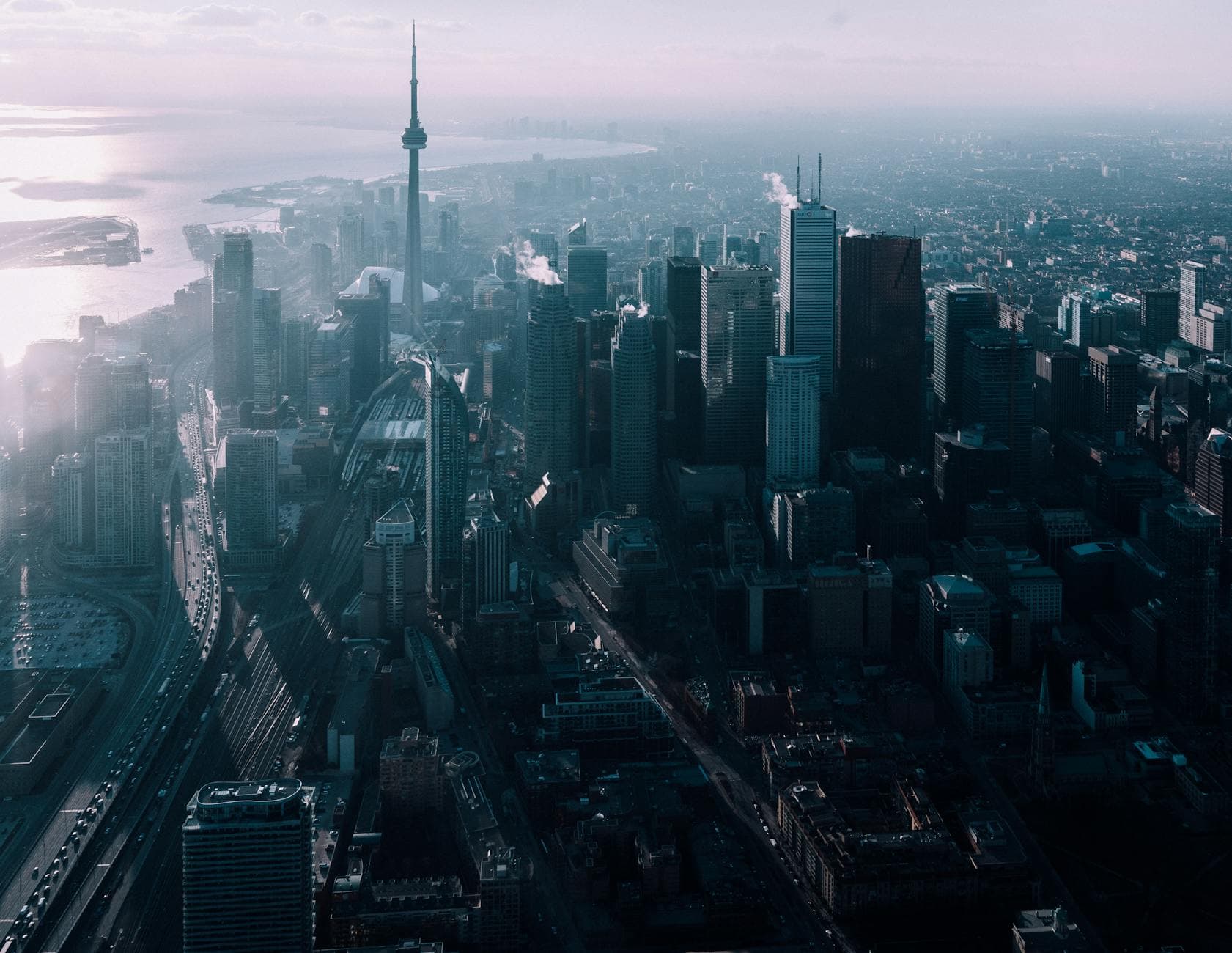 Stunning aerial view of Toronto's skyline featuring the iconic CN Tower at dusk.