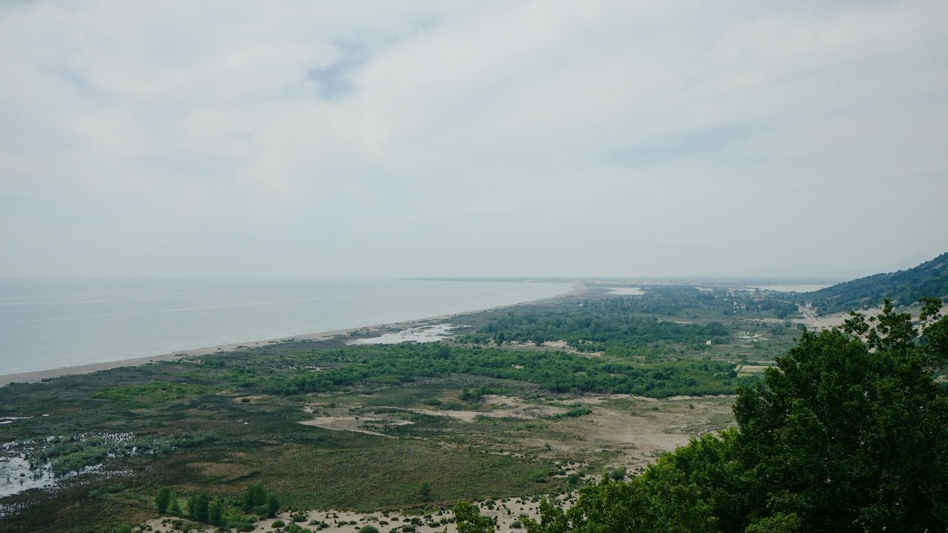 Aerial view of the lush Shëngjin coastline and beach in Albania.
