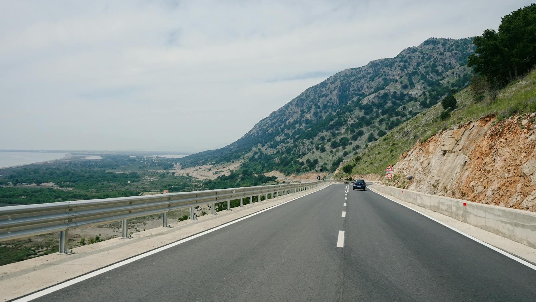 Explore the stunning mountain road along the Shëngjin coastline, Albania.