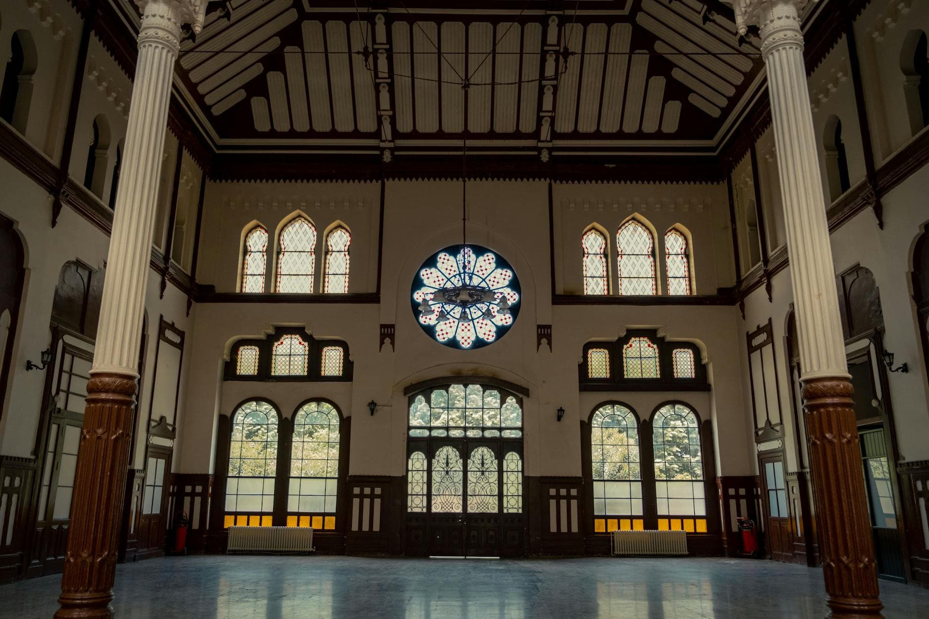 A stunning capture of Istanbul's Sirkeci Train Station interior, showcasing ornate design and stained glass.